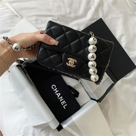 chanel pearl clear bag|Chanel bag with pearl chain.